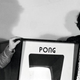 Ted Dabney (left) and Nolan Bushnell (right) with a Pong cabinet.
